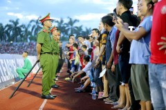 Vietnam football fans throw caution to the wind, disrupt game